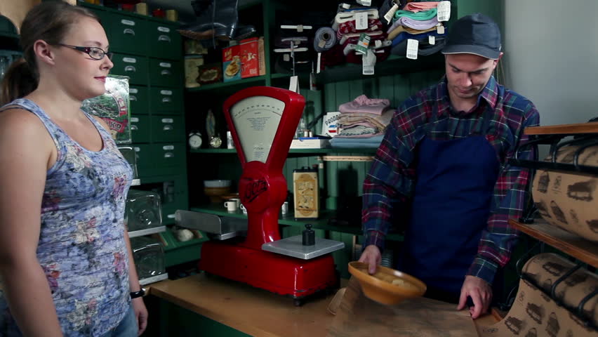 Shot of customers who are buying different things in an old, retro shop