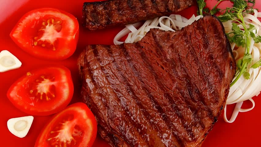 italian food : pasta with tomato and grilled sirloin beef on red plate 1920x1080 intro motion slow hidef hd
