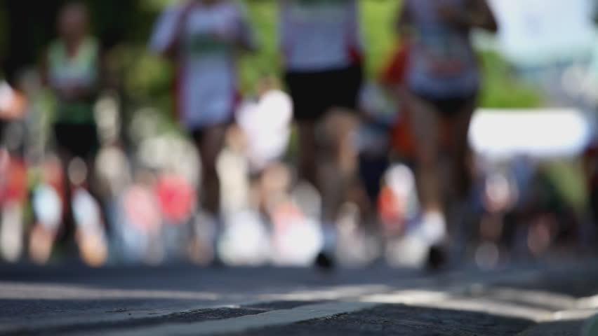 legs of marathon runners with shallow DOF