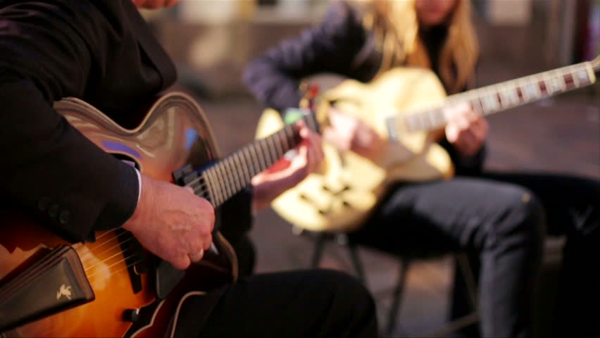 Guitarists busking and jamming