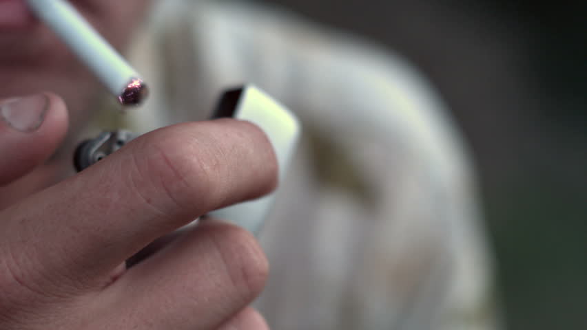 Male lighting cigarette