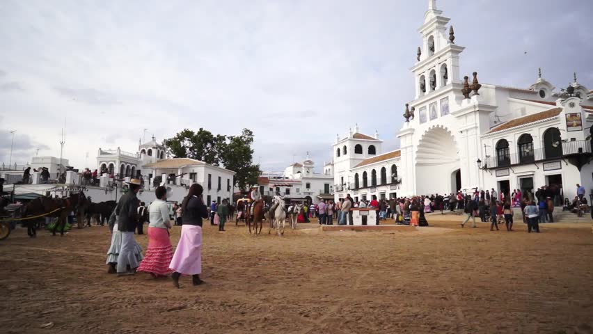 El ROCIO, ANDALUCIA, SPAIN - MAY 19: Pilgrims, people attend to the Sanctuario de Nuestra Senora de El Rocio in one of the most famous religious pilgrimage of Spain. May 19, 2013 in el Rocio, Spain