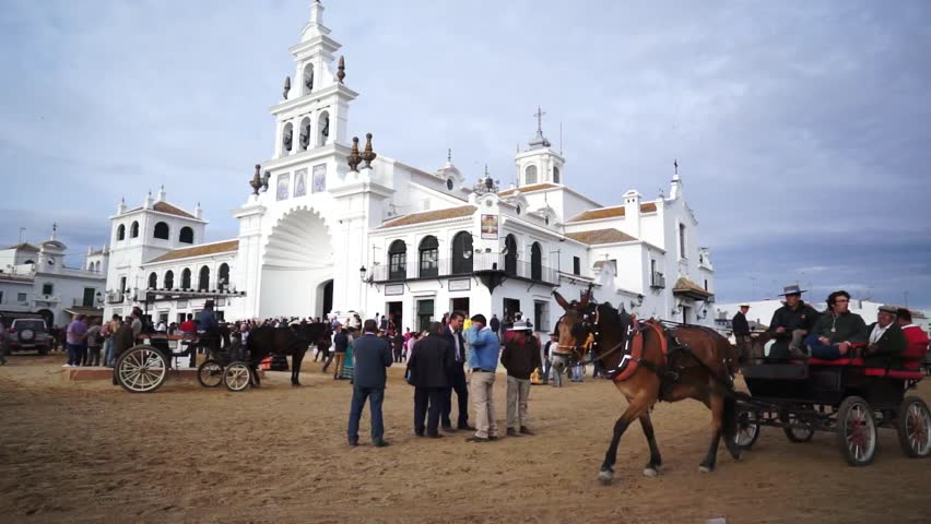 El ROCIO, ANDALUCIA, SPAIN - MAY 19: Pilgrims, people attend to the Sanctuario de Nuestra Senora de El Rocio in one of the most famous religious pilgrimage of Spain. May 19, 2013 in el Rocio, Spain