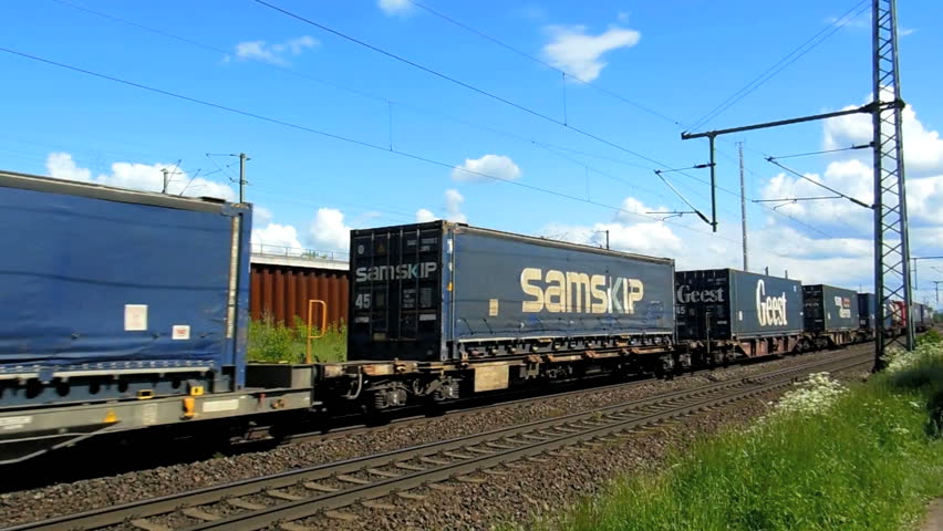 Cologne - circa may 2013 - Freight train with many cargo containers runs on the newly-built railway line for high-speed trains between Cologne and Bonn in may 2013.