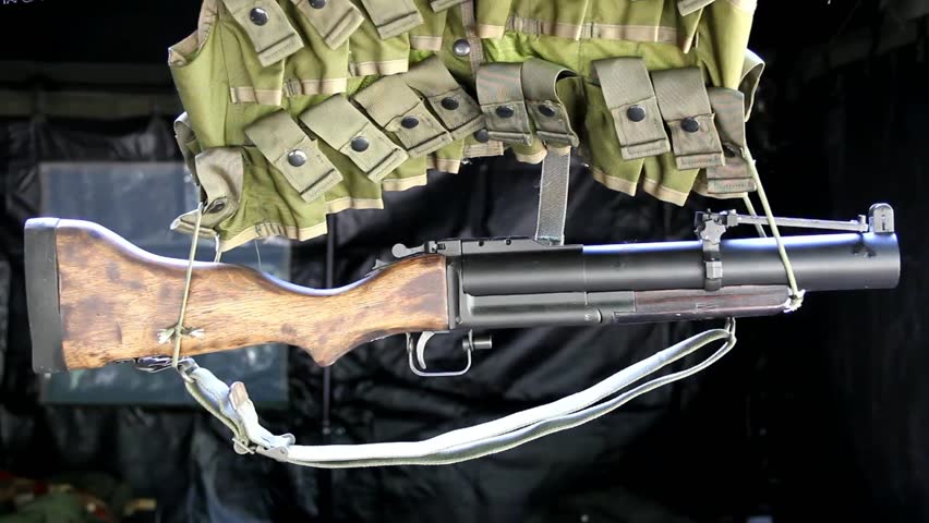 Old Style Grenade Launcher Hanging Below Ammunition Vest Slowly Swaying