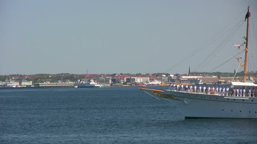 The Danish royal yacht 'Dannebrog' passing Kronborg in the Sound saluted by the guns on the first summer cruise.