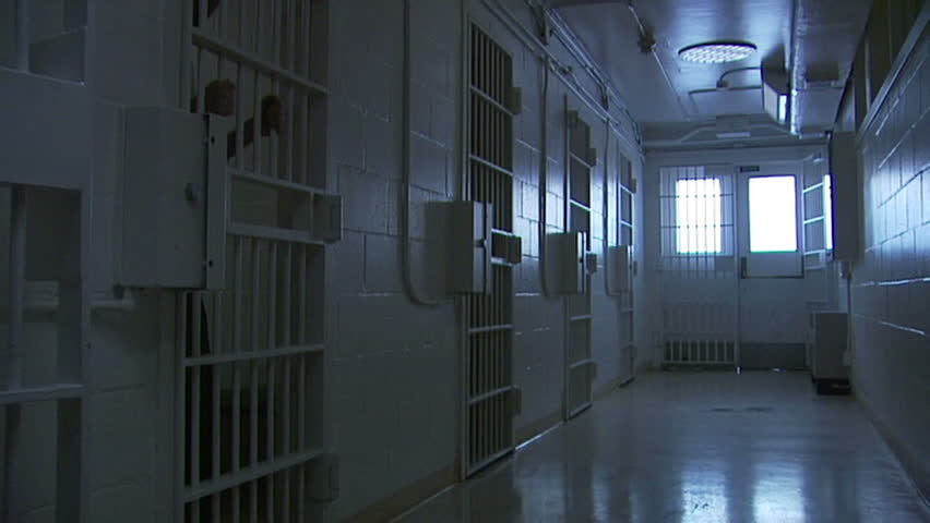 Perfect shot as B-roll for a piece of prison, violence, gangs. BONUS - an extra medium shot of an inmate holding the bars.