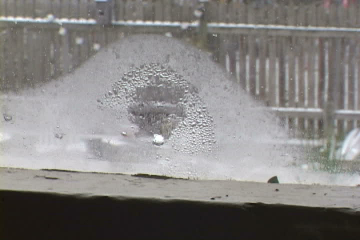A fun little happy face drawn on a window during snow storm in Oregon.