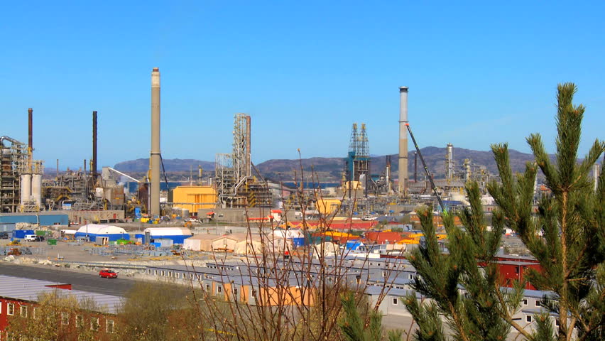 Oil refinery processing North Sea oil beside a nordic fjord