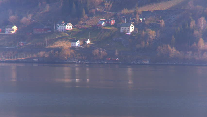 Oil tanker carrying processed North Sea oil along a nordic fjord