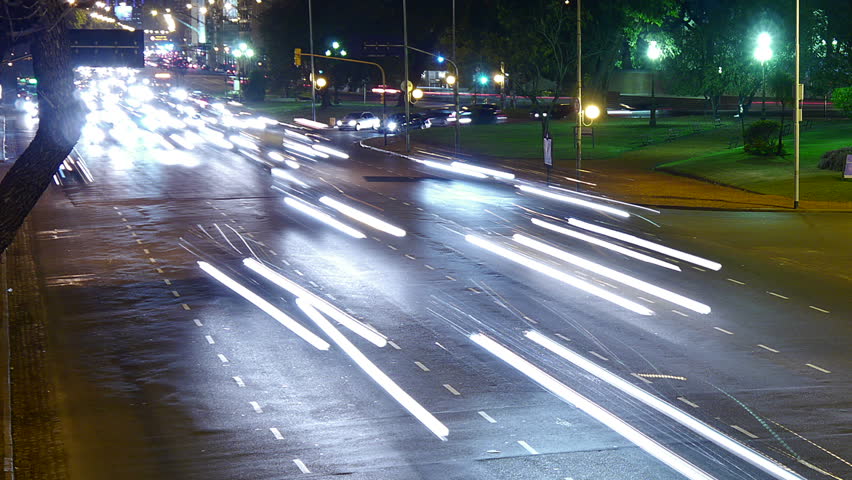 Traffic in the city. Avenue Time-Lapse, Night. Heavy traffic / jam / flowing with blurred motion. Dusk.