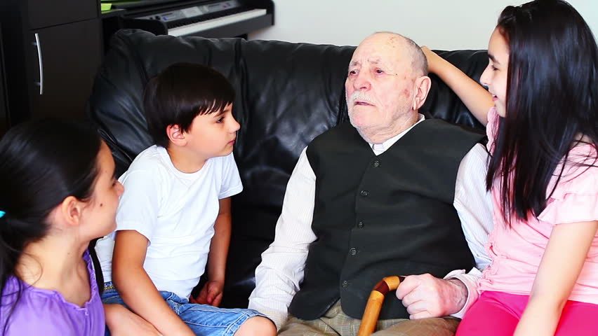 Grandfather telling a story to grandchildren