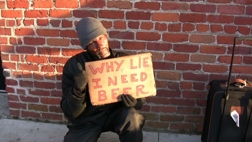 SAN FRANSISCO CA - APRIL 1: Homeless Man with Beer Sign asking for money on April 1, 2009 in San Fransisco, CA.