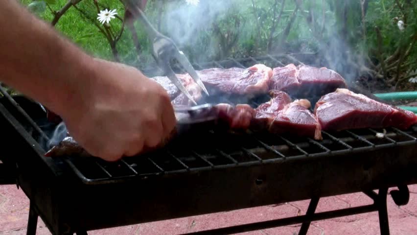 turn meat on bbq outside