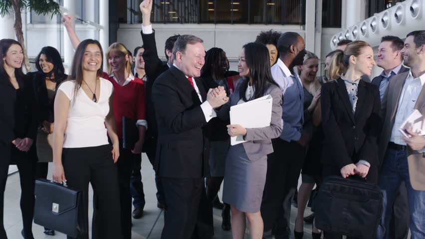 Large business team look into camera