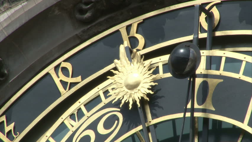 Close-up of astronomical clock on gothic Old Town Hall tower in Prague. Zoom out.
