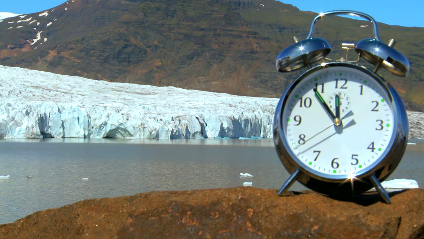 Time-lapse concept shot of the hands on a clock moving swiftly as time to prevent climate change runs out
