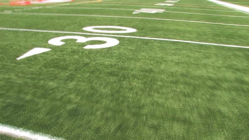 View of the astroturf while running 70 yards to the end zone. Shot using stabilizing Glidecam. 