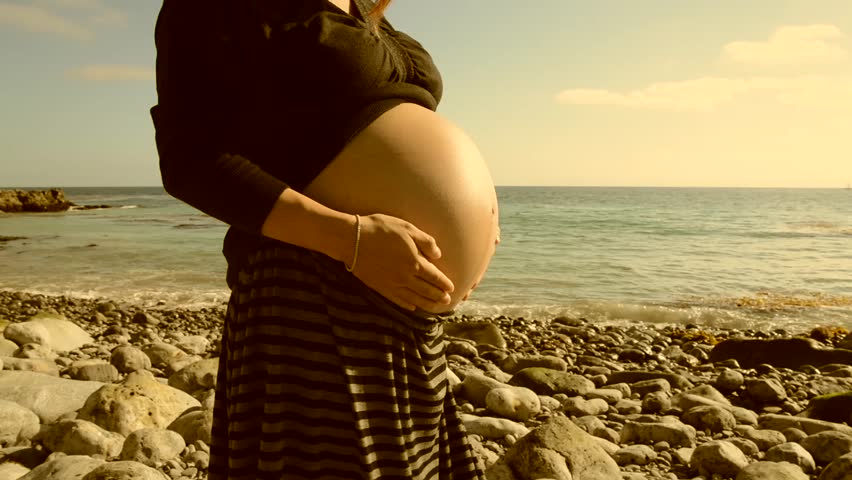Pregnant Woman Rubbing Her Belly On The Beach Stock Footage Video 5016152 Shutterstock 