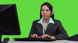 Supervisor talking on headset - green screen version