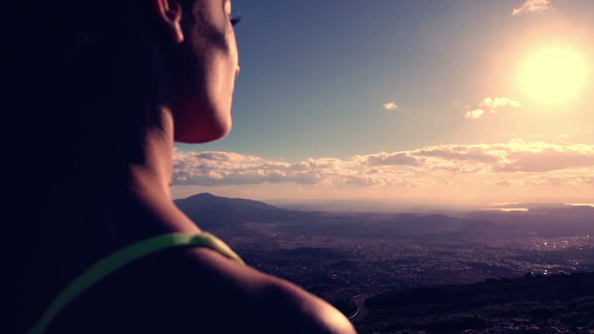 Woman Reaching The Top od the mountain