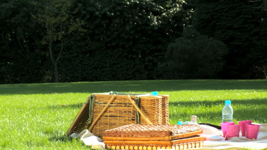 Young caucasian family enjoying time out together with a picnic on a summers day