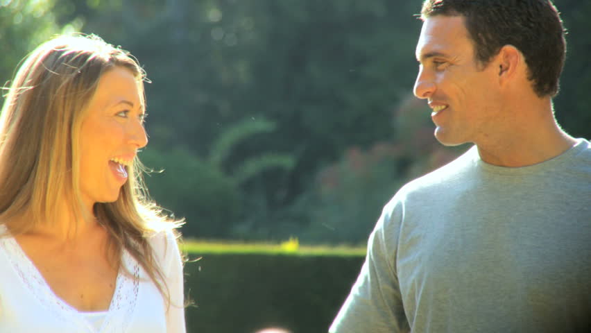 Attractive young couple happy to be together outdoors on a summers day