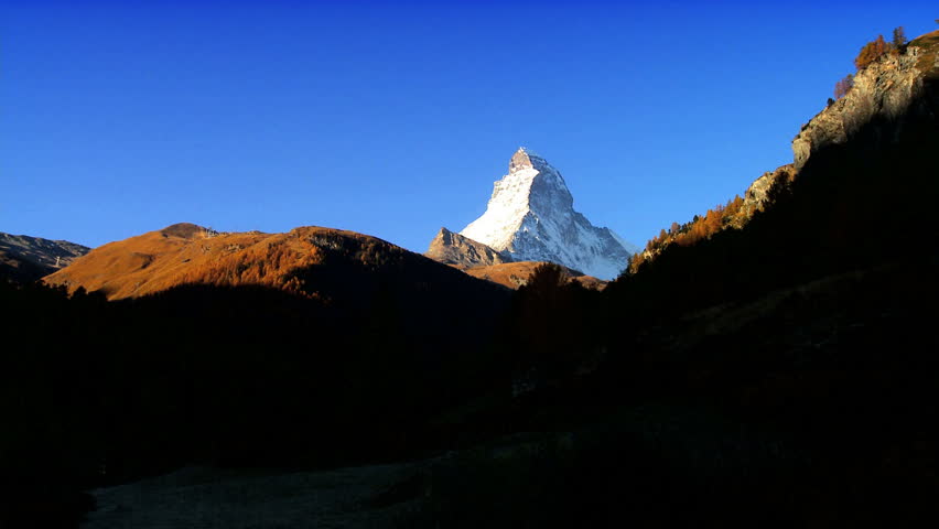 Time-lapse light over the Matterhorn, & alpine meadow, Switzerland