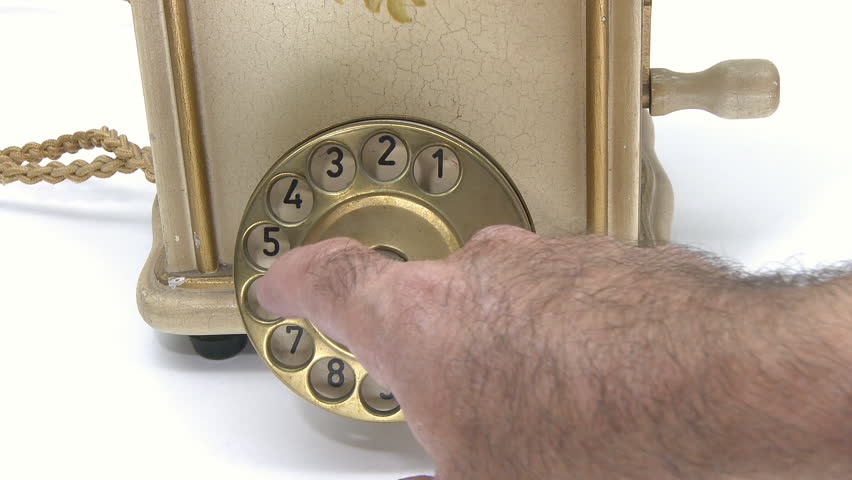 Making a phone call on vintage telephone