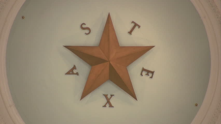 Video of the State capital of Texas. Austin Texas. Inside of government complex showing the historic designs. Rotunda dome with extensive decorations and numerous floor rails.Rotunda star zoom out