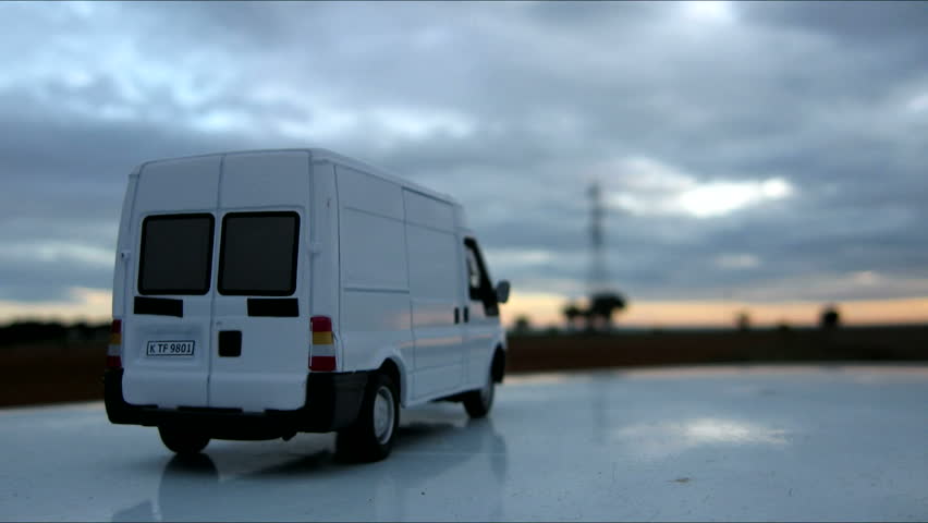 Model cargo van and fast clouds. Timelapse 