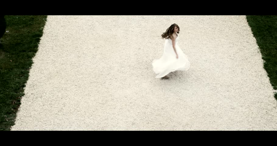 Beautiful bride in her wedding dress in front of a temple