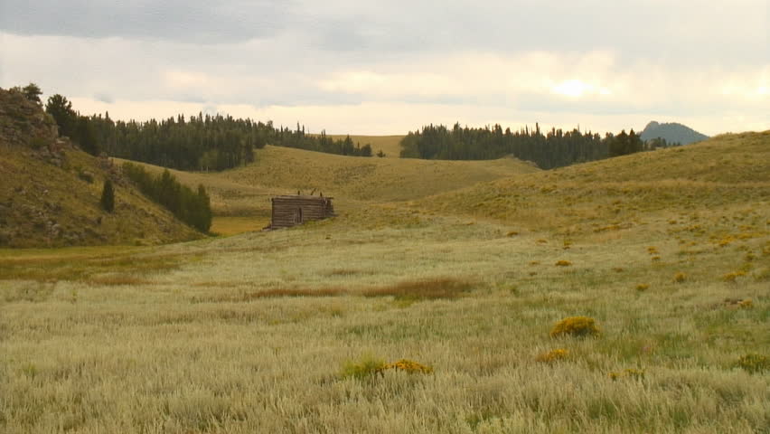 multiple shots of abandoned mountain cabin
