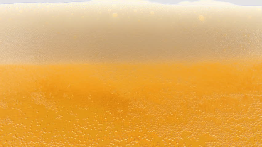 Pouring cold beer into glass