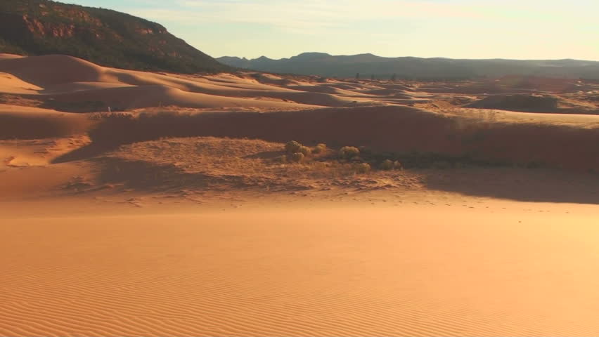 Arid landscape eerie in harsh afternoon light. 1920x1080