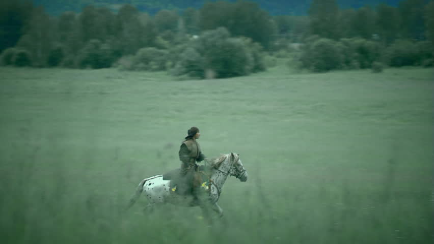 The ancient Asiatic warrior crosses a field. Reconstruction