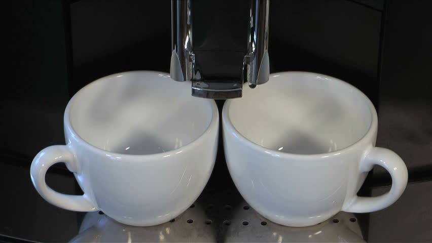 Fresh steaming espresso coffee being made