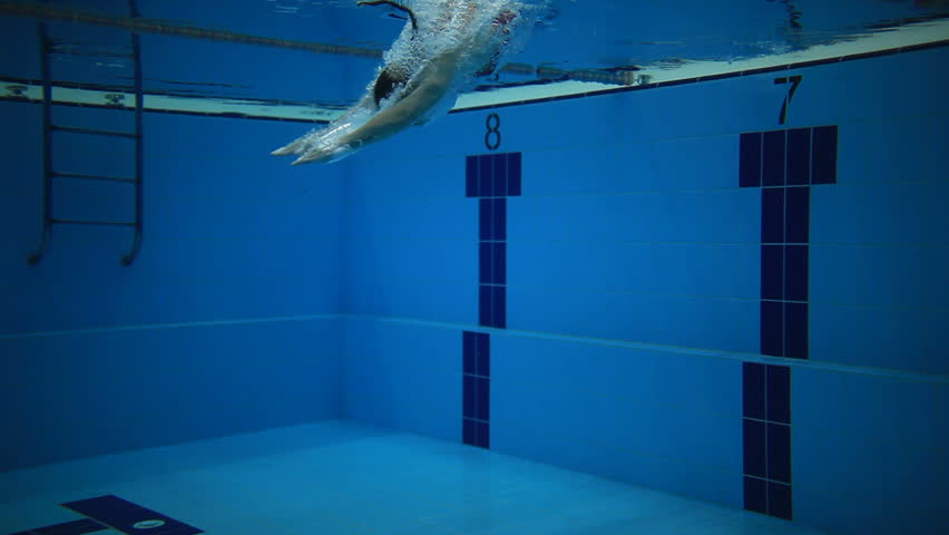 Underwater picture of a young woman swimming.