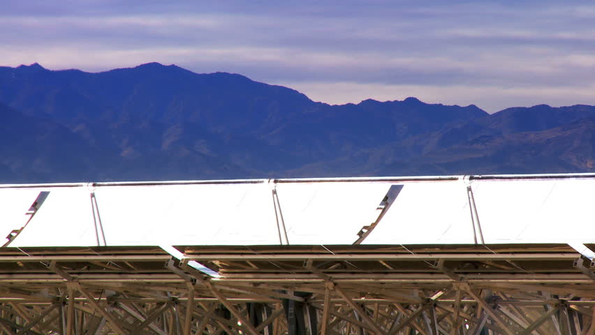 Farm of parabolic trough solar panels producing clean sustainable energy 