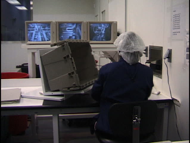 Pharmaceutical Manufacturing Worker Sorting Ampules of Medicine