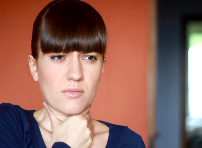 Young woman coughing 