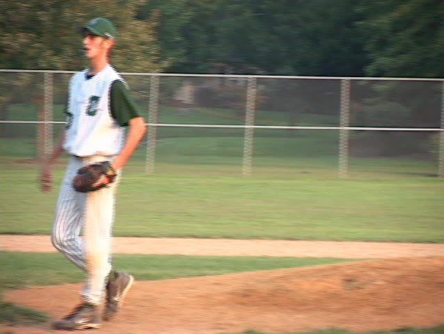young man pitches the ball
