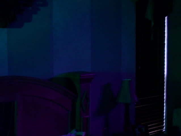 Couple asleep in bed in the predawn hours