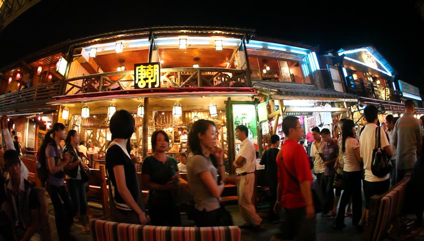DALI, CHINA - AUGUST 20: In the peak of the season, Chinese and world travelers enjoy  old town Dali, including old architecture, restaurants and the local river in Yunnan province, August 20, 2009