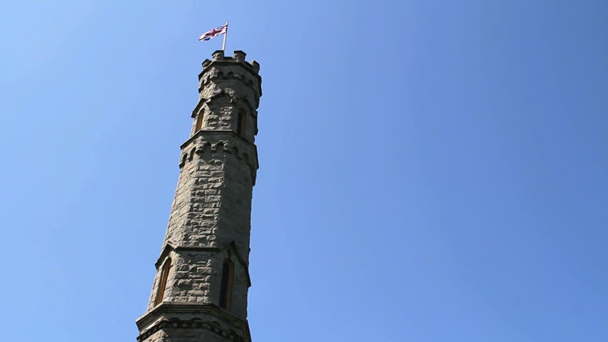 Union Jack (British Flag) flies from leaning castle tower