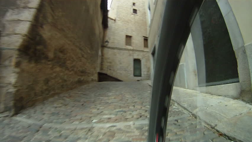 Mountain Bike ride along cobbled street
