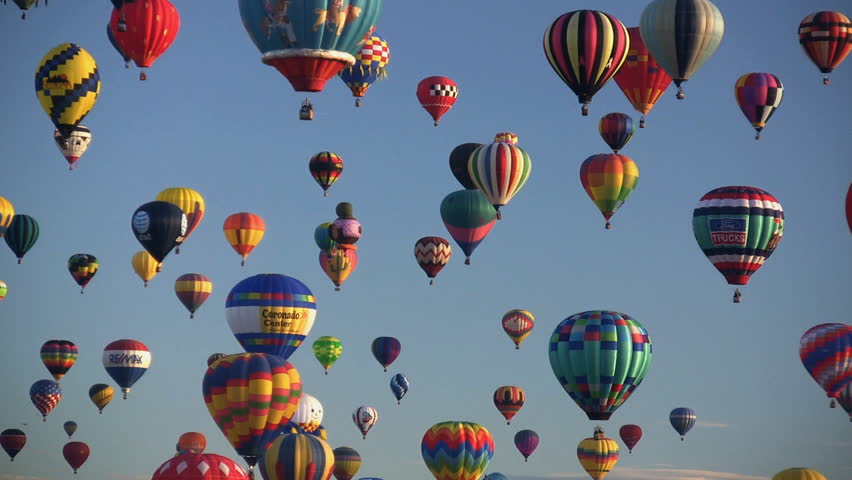Hot air balloons flying at the 2007 Albuquerque International Balloon Fiesta. The speed the accelerated on this clip. For Editorial use only.