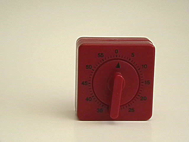 A hammer smashes a timer just before the time is up.