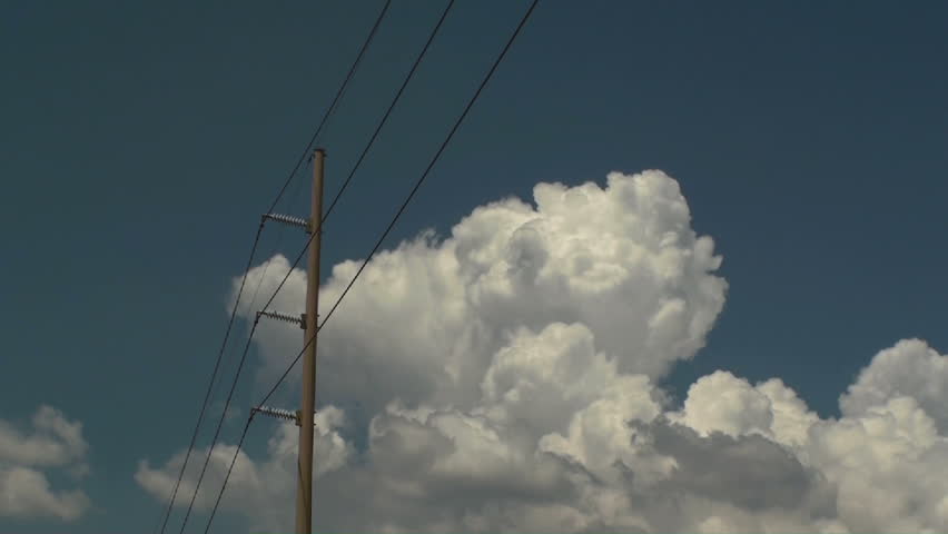 Time lapse, Monsoon clouds brew over telephone pole, wires.