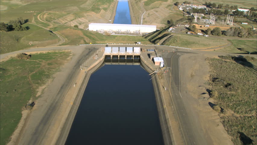 Aerial view over manmade irrigation chanel & hydro-electric dam